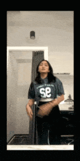 a woman wearing a shirt with the number 58 on it