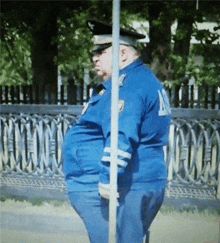two police officers are standing next to each other and one has the letter m on the back of his jacket
