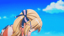 a girl with a bow in her hair looks down at something