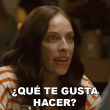 a woman in a striped shirt is asking " que te gusta hacer "