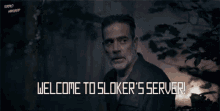 a man with a beard stands in a dark forest with the words welcome to sloker 's server