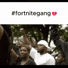 a group of people holding their fists in the air with #fortnitegang written on the bottom