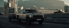 a truck with a trailer attached to it has a license plate that says ktn 2029
