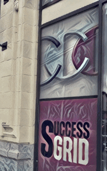 a sign on a building that says success grid on it