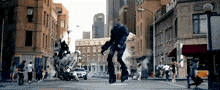 a robot on stilts is walking down a street in a city