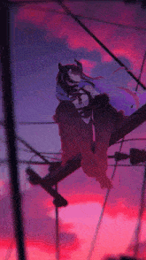 a girl with horns is sitting on a telephone pole with a pink sky in the background