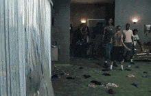 a group of people are standing in a living room