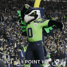 a mascot for the seahawks is standing in front of a crowd and says 1 point w