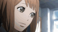 a close up of a girl with brown hair