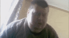 a close up of a man 's face with a blurred background .