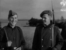 a black and white photo of soldiers with pathe written in the corner