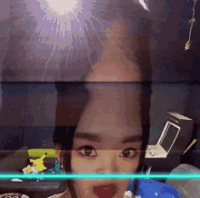 a close up of a woman 's face with a reflection of her face in a mirror .