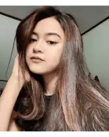 a woman with long hair is taking a selfie