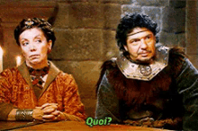 a man and a woman are sitting at a table and the woman is asking the man " quoi "