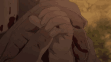 a bloody hand is holding another bloody hand