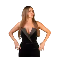 a woman in a black dress stands in front of a red star