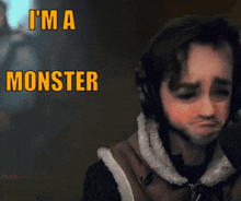 a man wearing headphones says " i 'm a monster " in orange letters