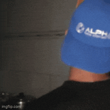 a man wearing a blue hat is making a funny face ..