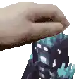 a pixel art of a hand holding a minecraft block