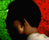 a close up of a person 's ear with a green background