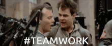 two men are standing next to each other and the word teamwork is on the bottom