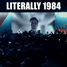 a crowd of people watching a movie with the words literally 1984