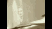 a woman is standing in front of a piano in a room .