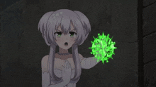 a girl in a white dress is holding a green circle with a circle of letters on it