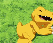 a cartoon character is laying in the grass with its eyes closed