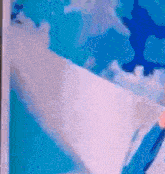 a close up of a person 's arm with a blue sky in the background .