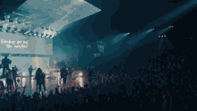 a large crowd of people watching a concert with the words together you will be excited on a large screen
