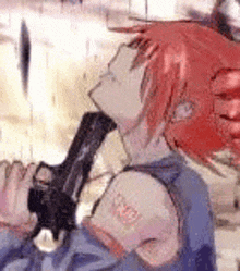 a girl with red hair is holding a gun in her hand .
