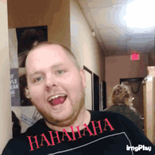 a man wearing a t-shirt that says '  hahaha ' on it