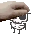 a hand is holding a drawing of a skull with sunglasses .