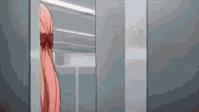 a woman in a pink dress is standing in front of a mirror in a room .