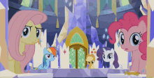 a group of ponies are standing in front of a castle with the word family on the bottom