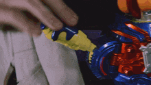 a close up of a toy that looks like a superhero 's helmet