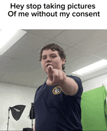 a boy pointing at the camera with the words hey stop taking pictures of me without my consent
