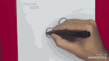 a person is drawing a circle with a marker on a piece of paper that says draw cute things on it