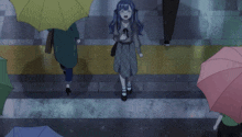 a girl with blue hair is walking down a street with umbrellas