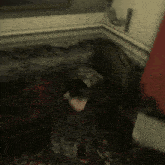 a blurry picture of a man in a suit and tie in a bedroom