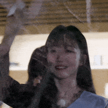 a close up of a woman 's face behind a glass window