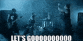 a band is playing in the rain with the words let 's goooooood written on the bottom