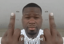 a man with a beard is giving the middle finger with the word fuck him written below him