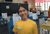 a man wearing a yellow shirt that says ' philippines ' on the front