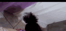 a close up of a person 's head with a bun on it .