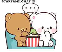 two teddy bears sitting on a couch eating popcorn