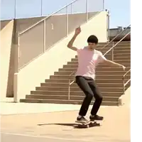 a man riding a skateboard down a set of stairs with the number 1 on the railing