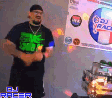 a man standing in front of a sign that says dj racer