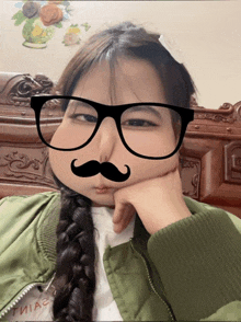 a girl with glasses and a fake mustache